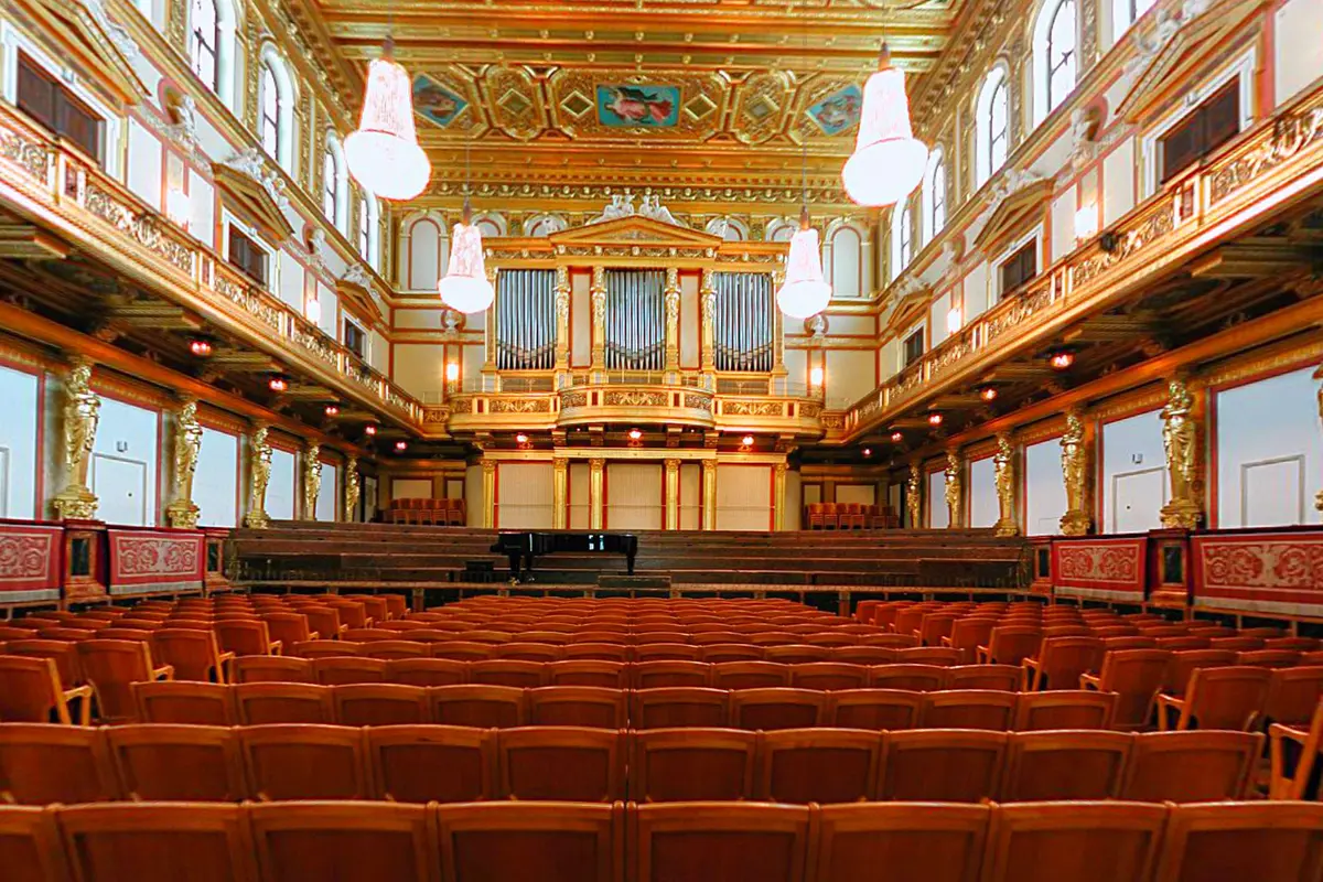 The Golden Hall of the Vienna Musikverein seen from the stalls, with the gilded balconies, ceiling paintings and organ above the stage